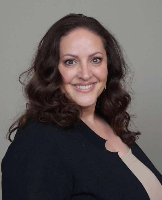 A headshot of Rosemary Rivas, a woman with long, dark hair.
