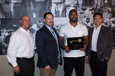 lance briggs receiving the award
