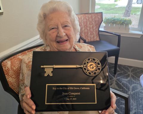 Jean receiving the award