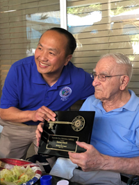 Samuel Rinelli receiving the award
