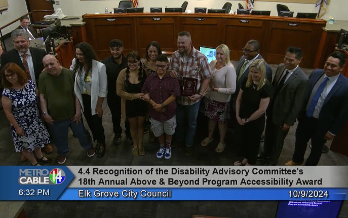"Photo of Project R.I.D.E. Board Members and Volunteer accepting the Above and Beyond Award from Disability Advisory Committee members and City Council"